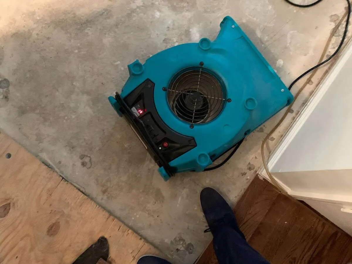 Air mover drying subfloor during Leak Detection & Repair in Lower Gwynedd